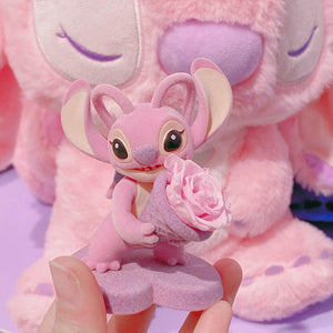 Detailed plush figure of Stitch from the Disney Flower Language series, holding a large pink flower bouquet, unique to Disney KSA.