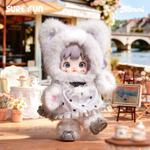 Popmart Nommi Series grey plush figure standing in an outdoor cafe setting